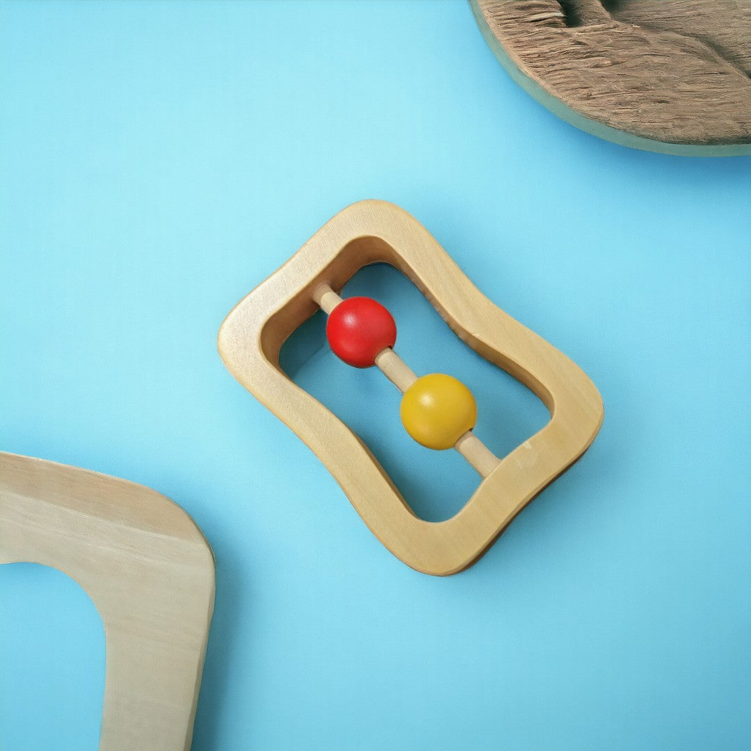 WOODEN RATTLE