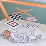 Transform your nursery into a wonderland of discovery with this captivating infant play gym! Three engaging hanging mobiles, each with unique textures and sounds, dangle above, sparking curiosity and encouraging reaching and grasping. The soft, padded play mat provides a comforting haven for tummy time and exploration, while the sturdy frame offers a sense of security. This versatile play gym grows with your baby, evolving from a newborn haven to a fun-filled activity center for curious toddlers.